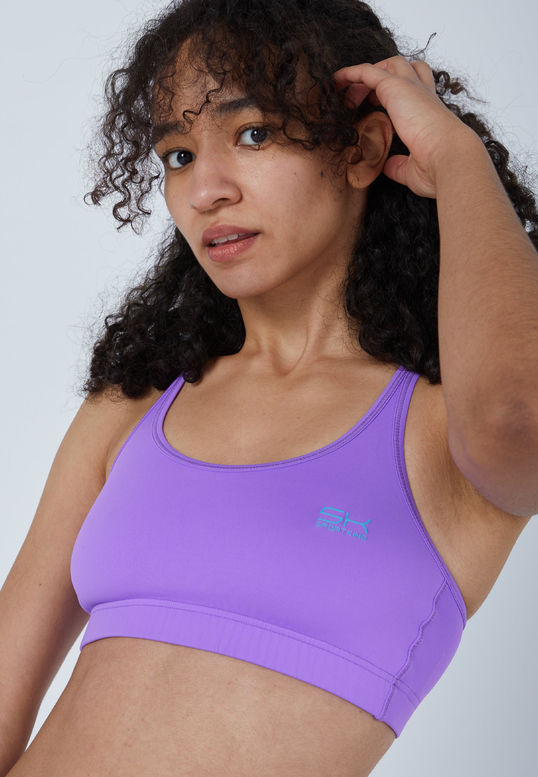 Sports bra with crossed straps in purple for girls and women